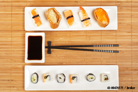 "Close-up of sushi and soy sauce" by broker